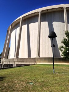 The circular Wood Federal Courthouse has graceful coulmns ringing the stone building.