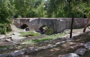 The double arched Espada aqueduct carries water in the acequia over Piedras Creek.